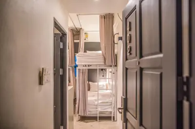 a hallway with a bunk bed in a room at Jam Hostel Bangkok in Bangkok