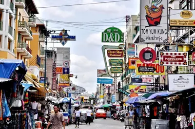 a busy city street with people walking down the street at New Siam III Guest House in Bangkok