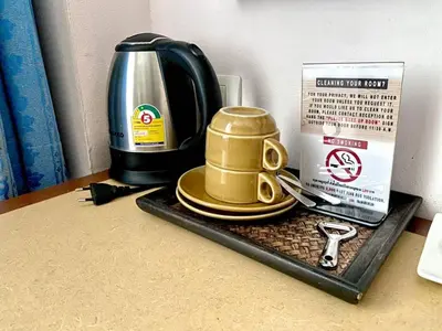 a tray with a coffee maker and a tea kettle at New Siam III Guest House in Bangkok