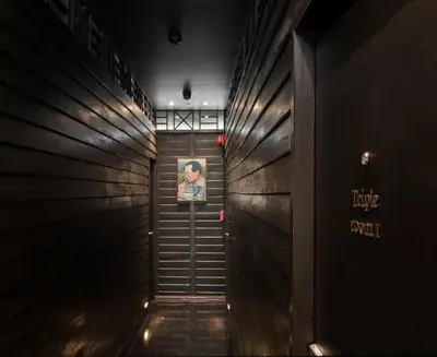 a hallway with a picture of a man on the wall at Kloem Hostel in Bangkok