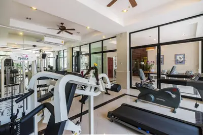 a gym with treadmills and elliptical machines at Asoke Residence Sukhumvit by UHG in Bangkok
