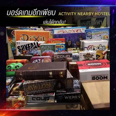 a shelf filled with lots of different types of food at Tuk Tuk Hostel in Bangkok