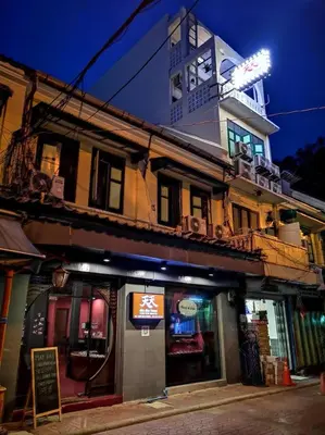 a building with a clock tower on top of it at Tian Tian Hostel in Bangkok