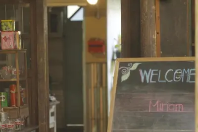 a sign that says welcome in a room at Phranakorn-Nornlen in Bangkok