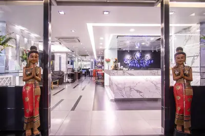 a couple of statues of women standing in front of a store at Gusto Pratunam Hotel in Bangkok