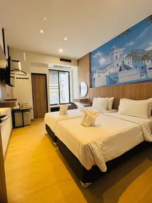 a hotel room with a large bed in a room at New Siam II in Bangkok