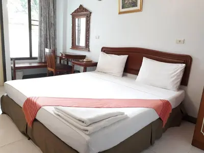 a bedroom with a large bed in a room at New Siam II in Bangkok