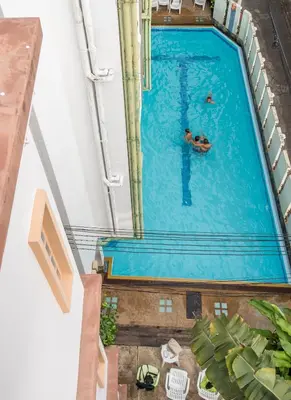 a person swimming in a swimming pool at New Siam II in Bangkok