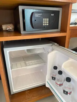 a microwave oven sitting on top of a refrigerator at New Siam II in Bangkok
