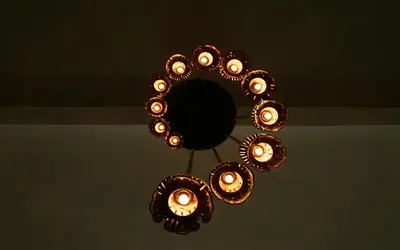a chandelier is hanging from a ceiling at Born Free Hostel in Bangkok