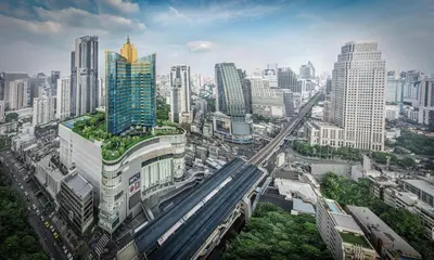 an aerial view of a city with a train at Grande Centre Point Hotel Terminal21 in Bangkok