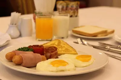 a plate of breakfast food on a table at Ebina House - SHA Extra Plus in Bangkok