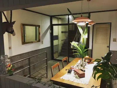a dining room table in a house with a tableablish at TANA CASA 12 Large Sathorn 6BR Townhome with Parking in Bangkok