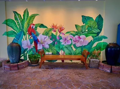 a mural of a parrot on a wall with plants at Salin Home Hotel Ramkhamhaeng in Bangkok