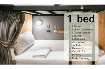 a poster of a bed in a room at Timber Hostel in Bangkok