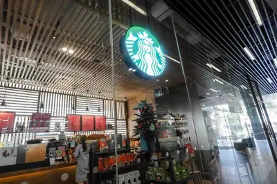 a store with a christmas tree in the center of the store at The Quarter Ari by UHG in Bangkok