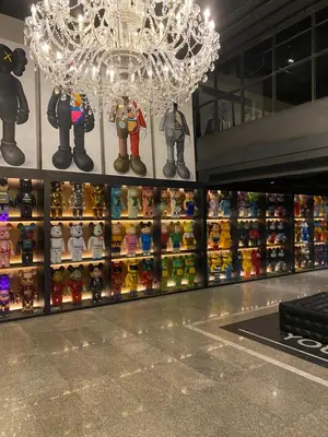 a chandelier in a store with a lot of toys at White Palace Bangkok in Bangkok