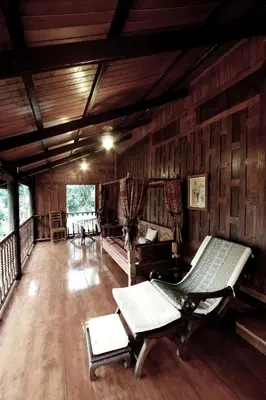a living room with a couch and chairs in it at Dhabkwan Resort in Nonthaburi