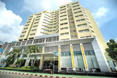 a tall building with a sign on the front of it at Summit Pavilion Hotel in Bangkok