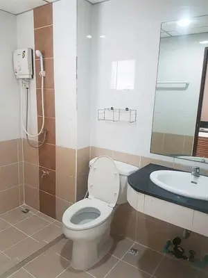a bathroom with a toilet and a sink at Mok Mek 72 in Bangkok