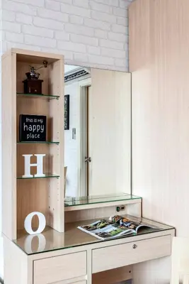 a mirror on top of a counter in a room at Nara Suite Residence Bangkok in Bangkok
