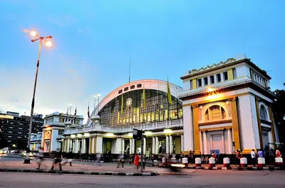 a large building with people walking in front of it at Four Sisters Homestay in Bangkok