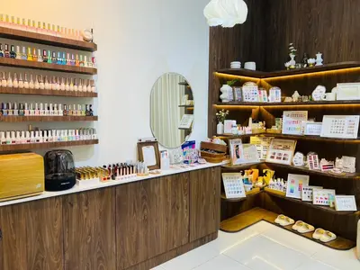 a cosmetics shop with a mirror on the wall at Four Sisters Homestay in Bangkok