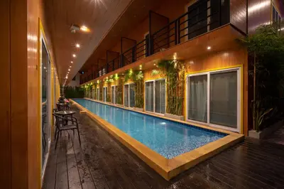 a swimming pool in the middle of a building at Resort V - MRT Huai Khwang in Bangkok