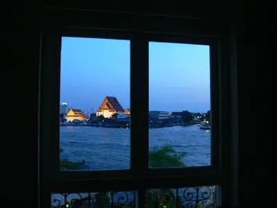a window with a view of a body of water at Aurum The River Place in Bangkok