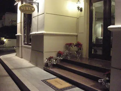 a lobby of a building with a sign on the wall at Aurum The River Place in Bangkok