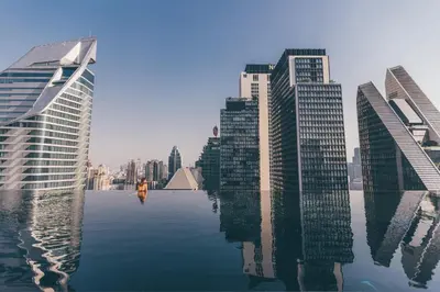 a view of a city with tall buildings and water at The Okura Prestige Bangkok in Bangkok