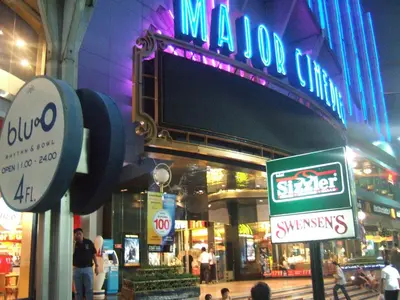 a large sign on the side of a building at Lodge 61 Hotel in Bangkok