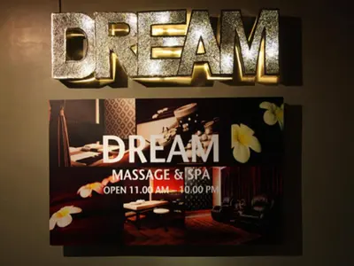 a sign on a wall with the word dream on it at Siam Swana in Bangkok