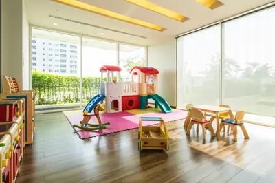 a childrens room with a play set and a table and chairs at Ivy Thonglor 55 in Bangkok
