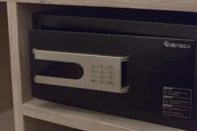 a microwave oven sitting on top of a shelf at Maxim's Inn in Bangkok