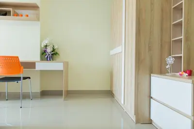a room with a table and a chair and a desk at Be My Guest 36 in Bangkok