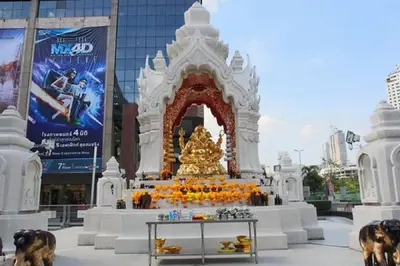 a large monument in front of a building at The Konnect Hotel in Bangkok