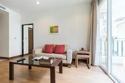 a living room with a couch and a table at Bangkok Patio BTS Sanam Pao in Bangkok