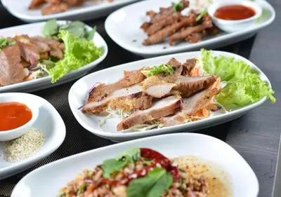 a group of plates of food on a table at Chillax Heritage Hotel Khaosan in Bangkok