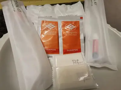 a group of white plastic bags sitting on a table at Tongtara Riverview Hotel in Bangkok