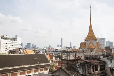 a view of a city skyline with a pagoda at The Orientale Hostel in Bangkok