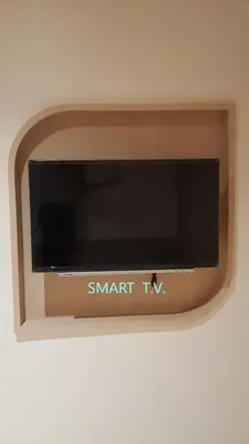 a small tv with the name smart tv on a wall at W 21 Hotel Bangkok in Bangkok