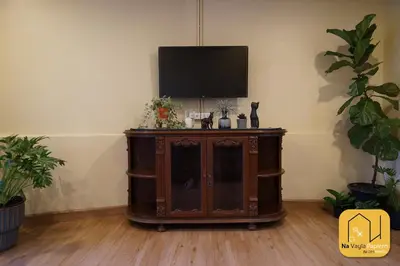 a entertainment center with a television on top of it at Na Vayla PaPlern in Bangkok