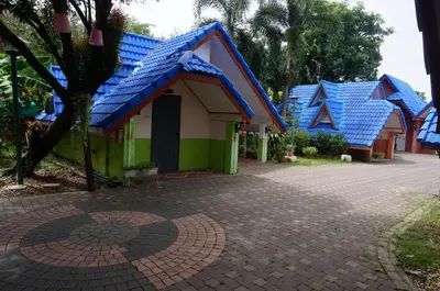 a row of houses with blue roof at 58 Ville Resort in Bangkok