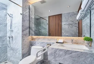 a bathroom with a toilet and a sink at Amp Am House Bangkok Hotel in Bangkok