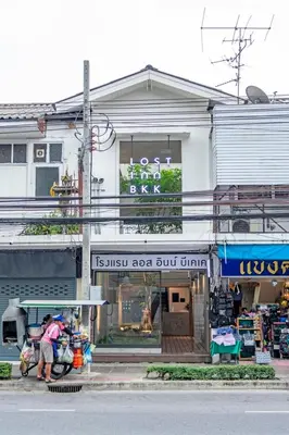 a store with a sign in front of a building at Lost Inn BKK in Bangkok