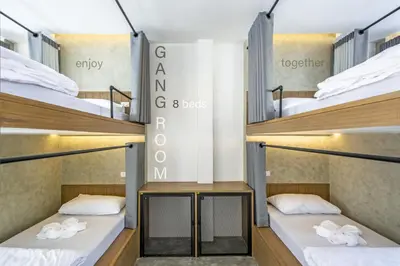 a room with three bunk beds in a hostel at Lost Inn BKK in Bangkok