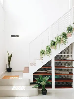 a staircase with potted plants on it at LITA Bangkok in Bangkok