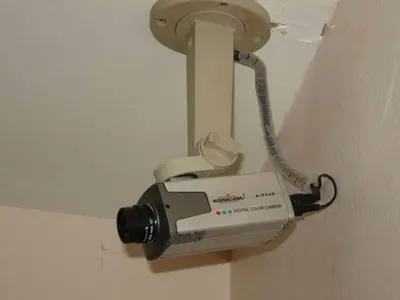a phone hanging on a wall in a room at Rambuttri House in Bangkok