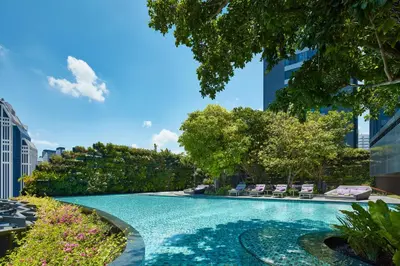 a swimming pool in the middle of a city at Hyatt Regency Bangkok Sukhumvit in Bangkok